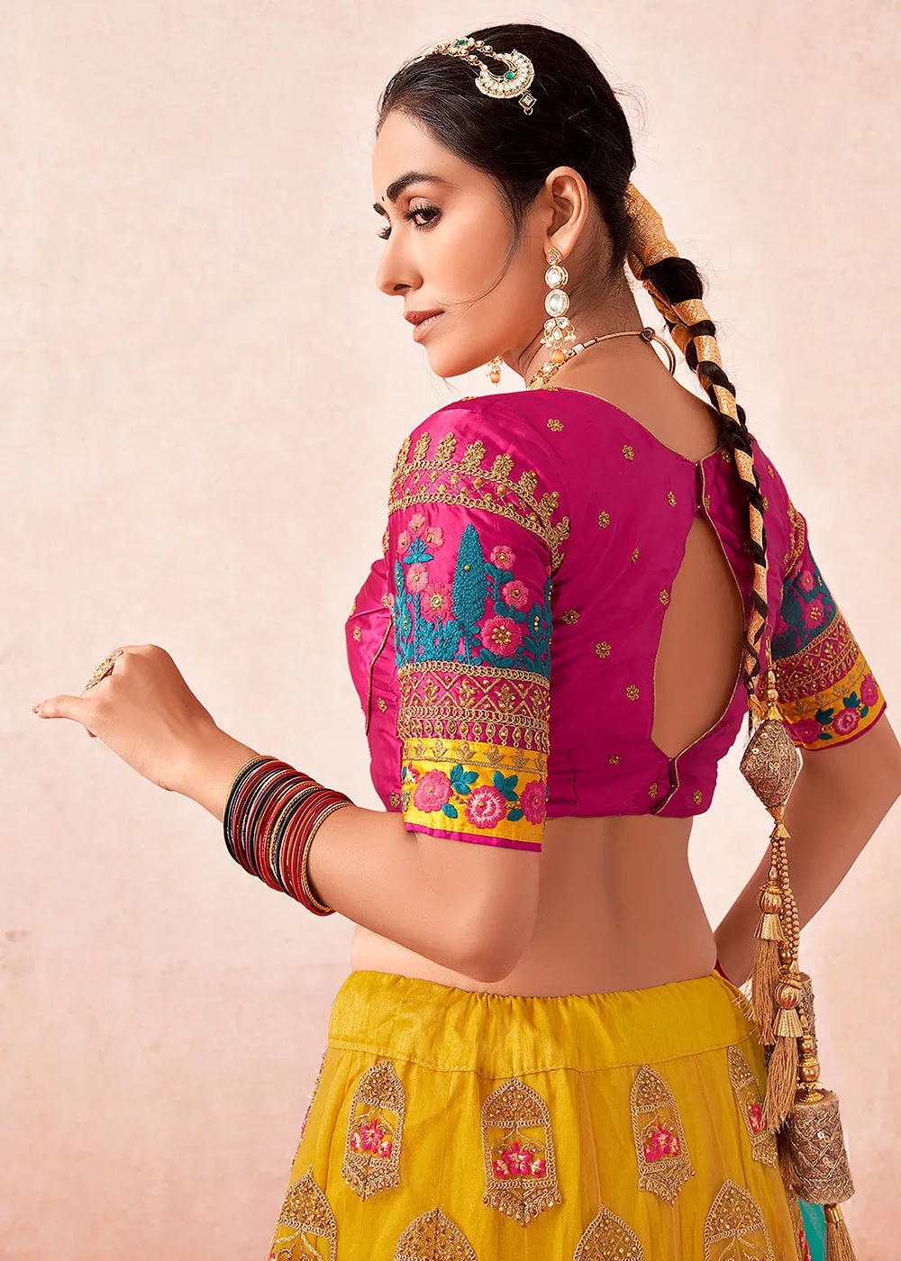 Traditional Yellow & Magenta Kalidar Embroidered Net Lehenga Choli